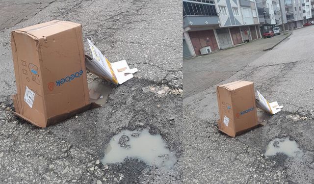 Çukuru karton kutularla kapattılar